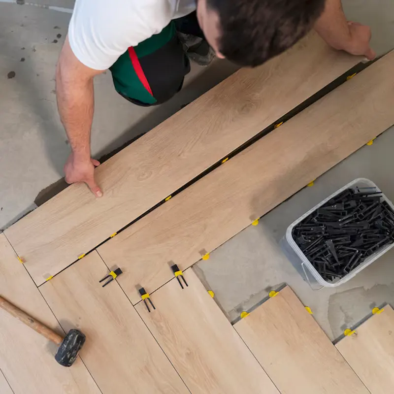Local floor tradesmen in jersey doing a floor installation.