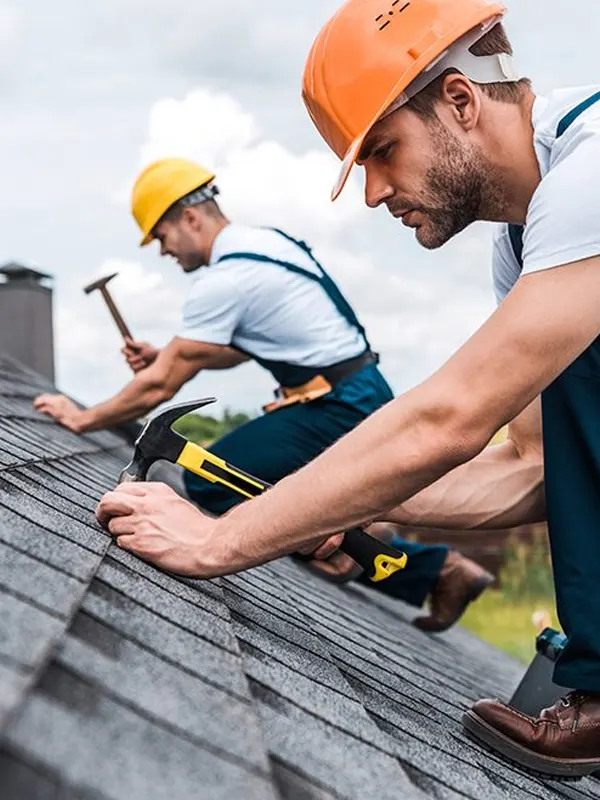 Expert roofers in Jersey doing new roofing services in a residential roof.