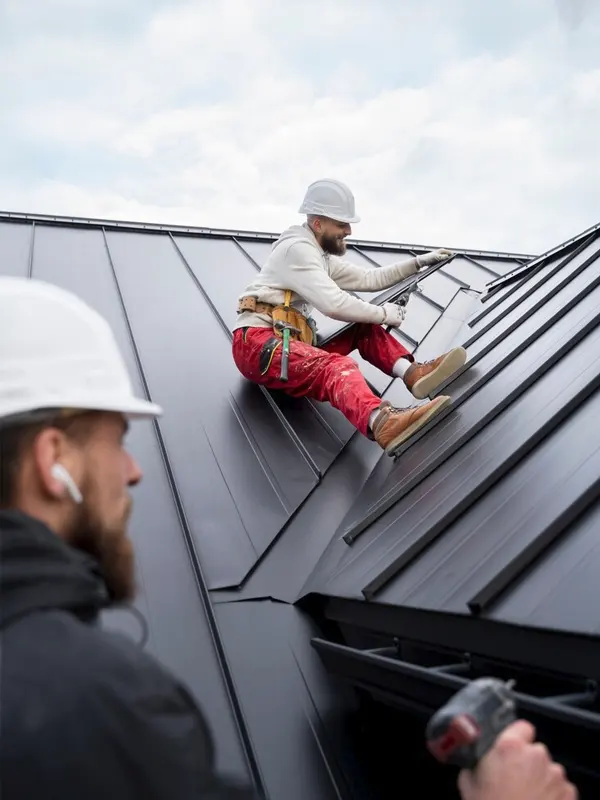Roof repairmen installing a roof in Jersey.
